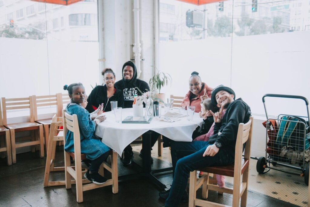 families at table enjoying house dinner